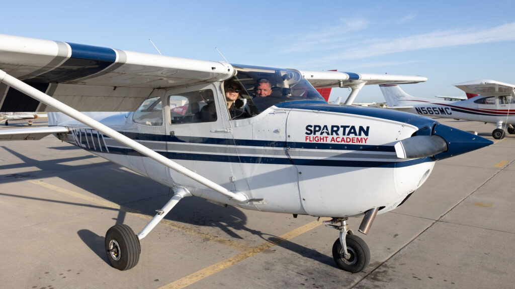 spartan flight academy plane on tarmac with students inside
